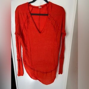 Red/ Orange We the Free waffle knit long sleeve. Size Small but it’s oversized.